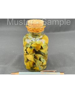 Fossilized (petrified) wood with green and yellow opal; in glass bottle; Indonesia; 1 piece.