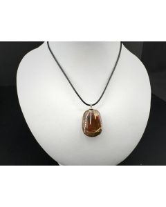 Matrix Opal; multicolored, Dark Chocolate Opal; Shewa Ridge, Africa; 17 ct, 22 × 15 × 8 mm; as pendant with leather cord; unique piece 
