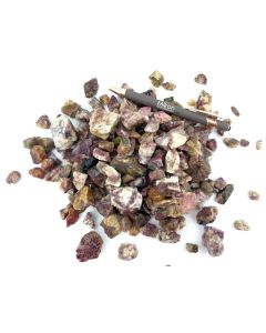 Tourmaline, rubellite in matrix (partly UV-active!); small, Madagascar; 1 kg