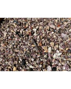 Tourmaline, rubellite in matrix (partly UV-active!); small, Madagascar; 100 kg